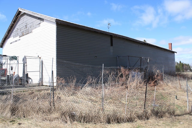 view of outdoor structure with fence