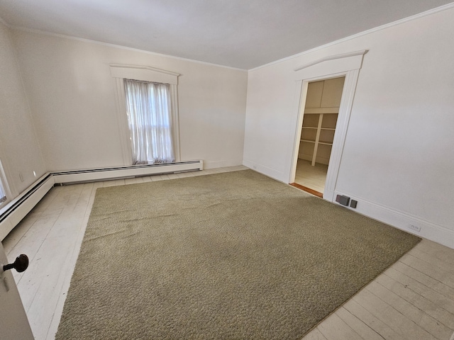 72 Main St, Orono, ME 04473 - spare room featuring crown molding, baseboards, wood finished floors, and visible vents