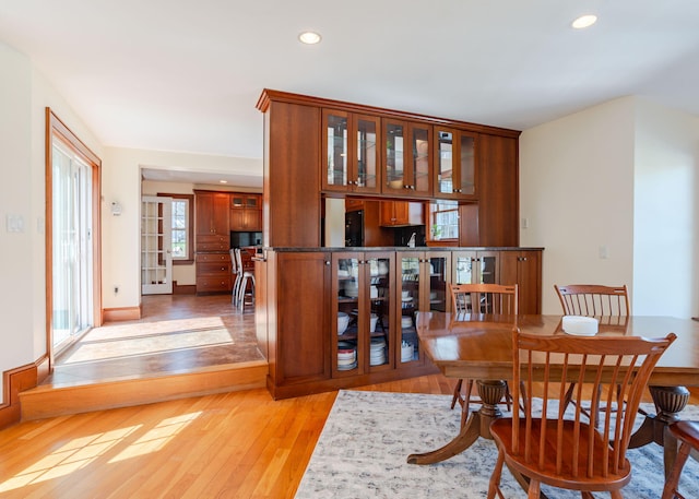 dining space featuring light wood-type flooring and recessed lighting