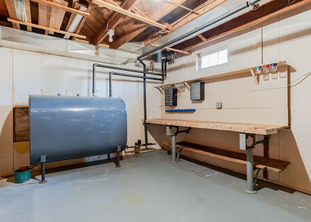 below grade area with a workshop area and heating fuel