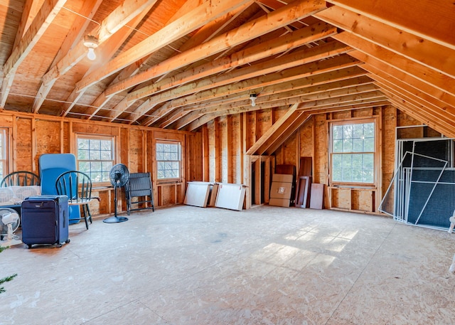 unfinished attic featuring plenty of natural light