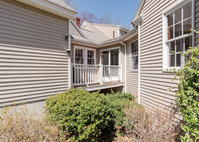 property entrance featuring a chimney