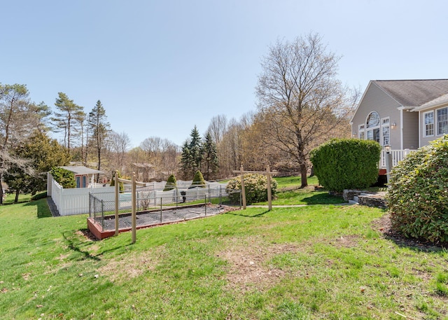 view of yard featuring a garden and fence