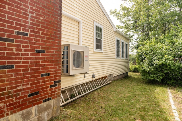 157 S Tibbetts Ave, Wells, ME 04090 - view of property exterior featuring a yard, crawl space, and ac unit