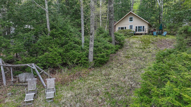 65 Pinecroft Rd, Harrison, ME 04040 - view of yard featuring a deck and a view of trees