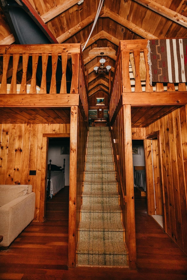 65 Pinecroft Rd, Harrison, ME 04040 - stairs with vaulted ceiling, wooden walls, hardwood / wood-style flooring, and wood ceiling