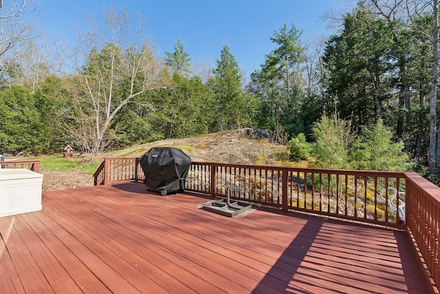 wooden deck featuring area for grilling