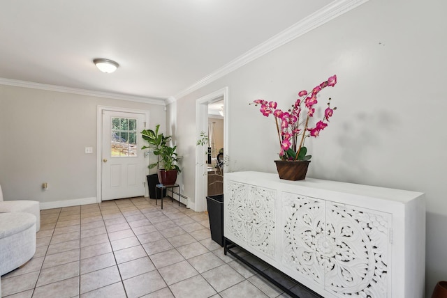 foyer with crown molding, baseboards, and light tile patterned floors