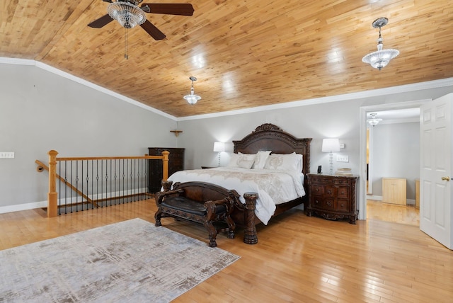 bedroom with crown molding, wood ceiling, wood-type flooring, and vaulted ceiling