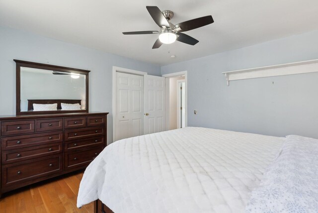 bedroom featuring a ceiling fan and light wood finished floors