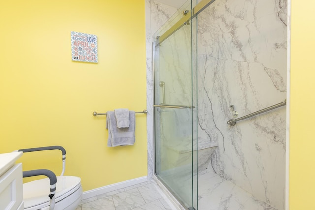 7 Berry Ln Unit 101, Biddeford, ME 04005 - bathroom featuring marble look tile flooring, a marble finish shower, toilet, vanity, and baseboards