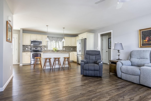 7 Berry Ln Unit 101, Biddeford, ME 04005 - living room with dark wood-type flooring, a ceiling fan, and baseboards