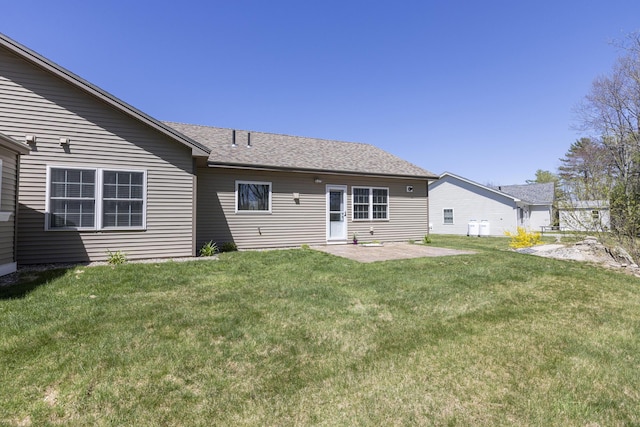 7 Berry Ln Unit 101, Biddeford, ME 04005 - back of house with a lawn, a patio, and a shingled roof
