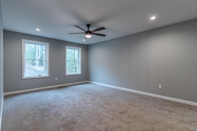 empty room with a ceiling fan, carpet flooring, and recessed lighting