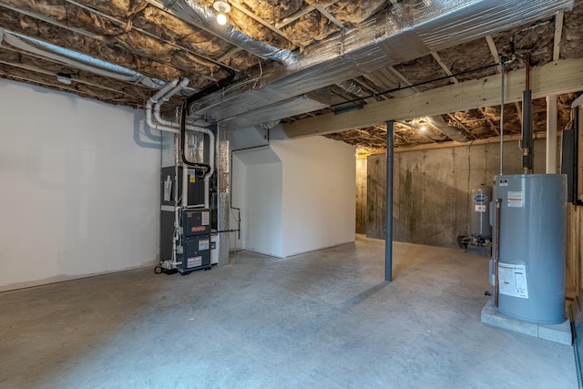 unfinished basement featuring heating unit and gas water heater