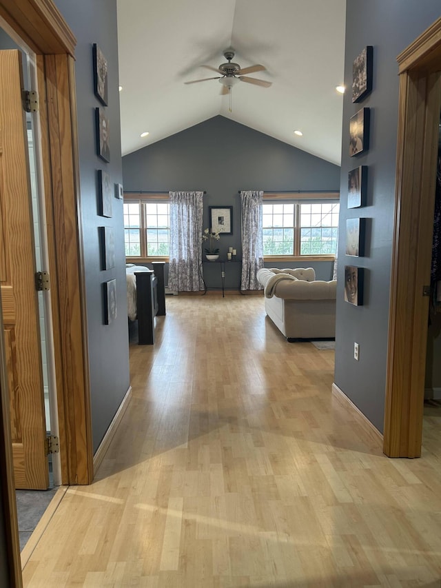 208 N Caribou Rd, Presque Isle, ME 04769 - hallway with recessed lighting, lofted ceiling, wood finished floors, and a healthy amount of sunlight