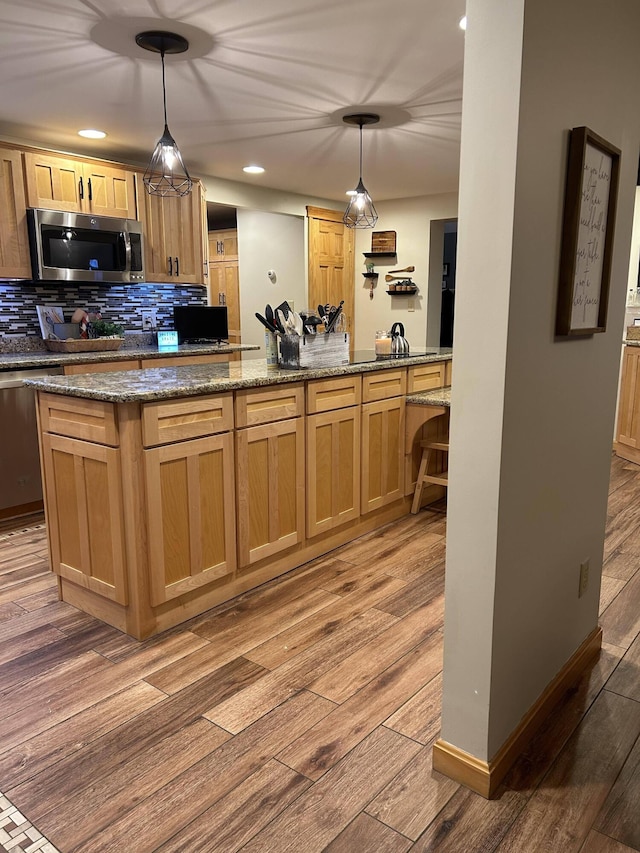 208 N Caribou Rd, Presque Isle, ME 04769 - kitchen featuring light brown cabinets, backsplash, stainless steel appliances, and light wood-type flooring