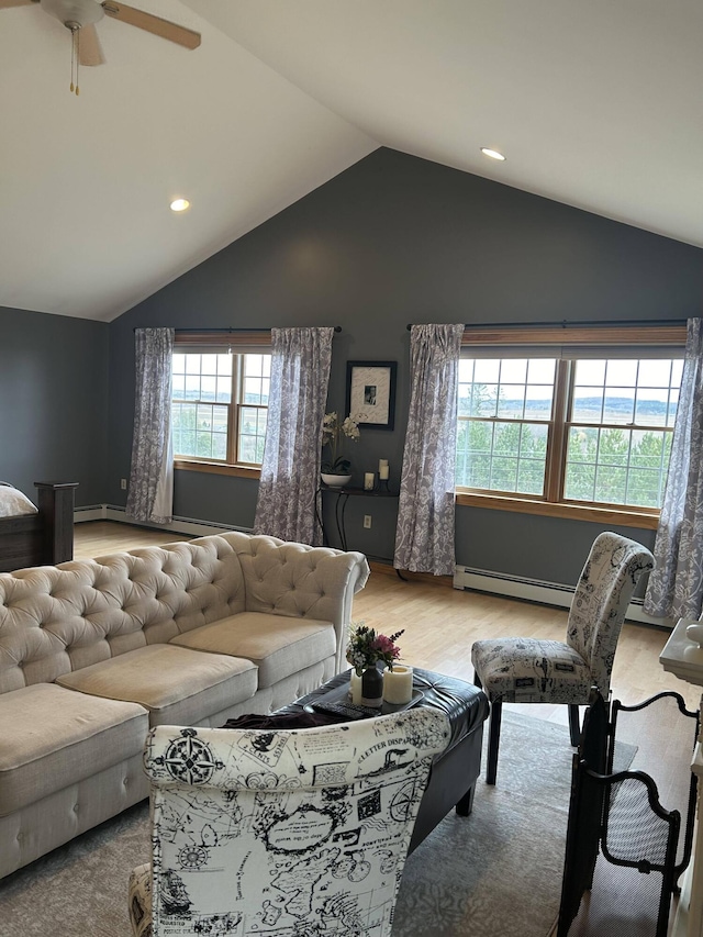 208 N Caribou Rd, Presque Isle, ME 04769 - living area featuring wood finished floors, ceiling fan, recessed lighting, a baseboard heating unit, and vaulted ceiling