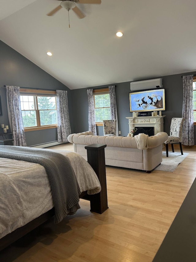 208 N Caribou Rd, Presque Isle, ME 04769 - bedroom with recessed lighting, multiple windows, a wall mounted AC, and light wood finished floors