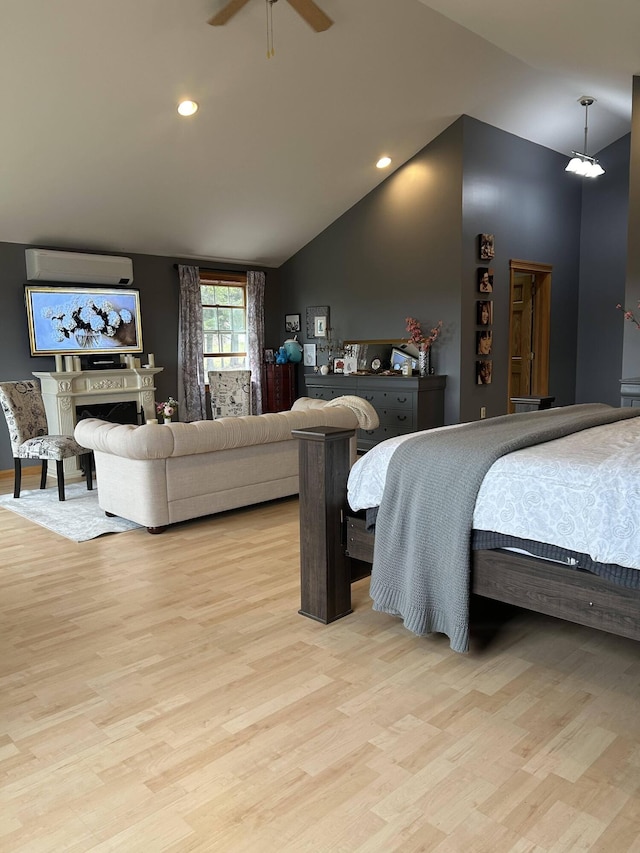 208 N Caribou Rd, Presque Isle, ME 04769 - bedroom with light wood-style flooring, recessed lighting, a ceiling fan, a wall unit AC, and vaulted ceiling