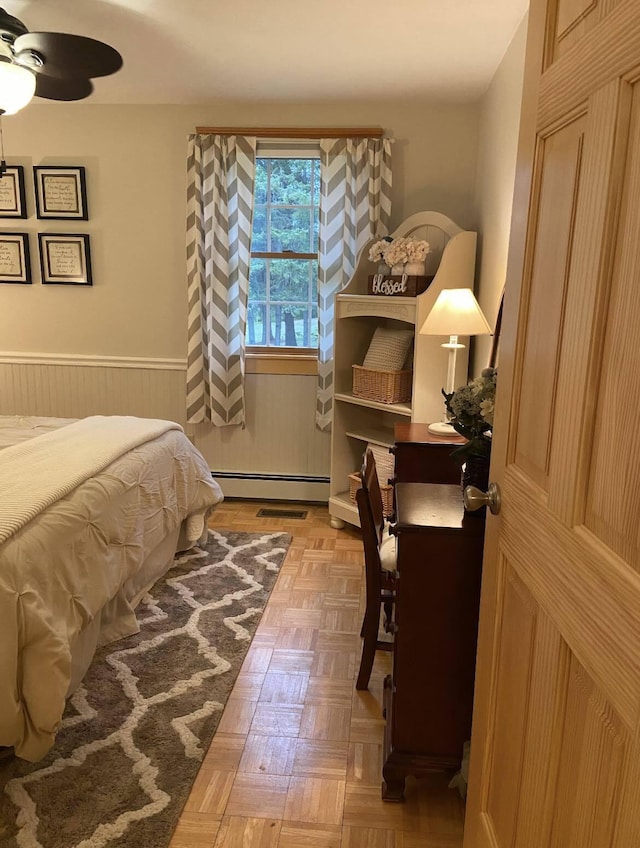 208 N Caribou Rd, Presque Isle, ME 04769 - bedroom with a baseboard radiator and a wainscoted wall