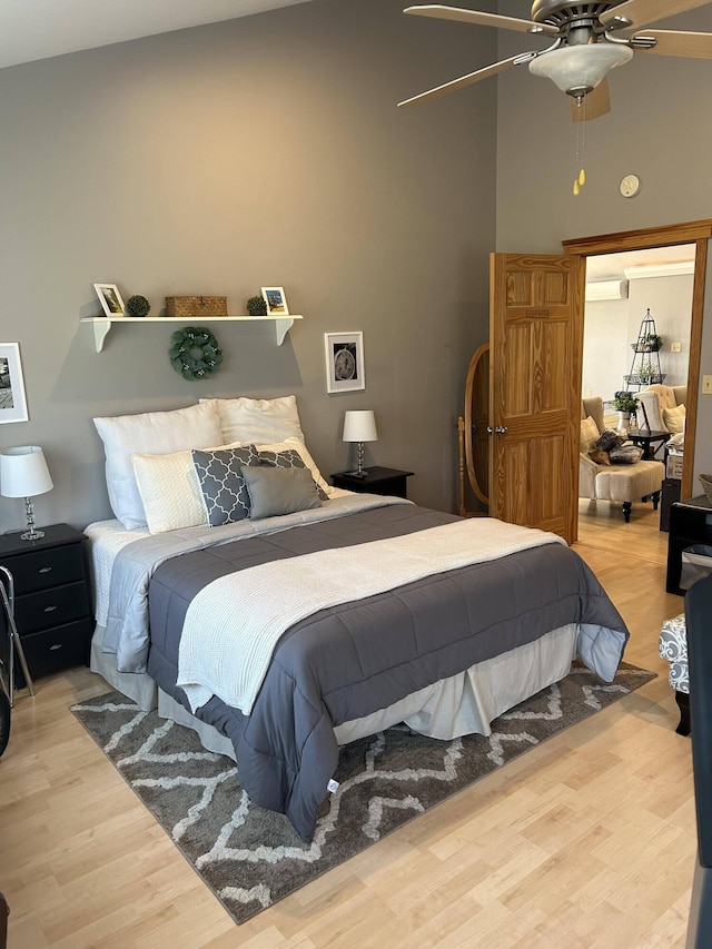 208 N Caribou Rd, Presque Isle, ME 04769 - bedroom featuring a ceiling fan, a wall unit AC, and wood finished floors