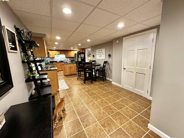 208 N Caribou Rd, Presque Isle, ME 04769 - tiled dining space with recessed lighting, a sink, and baseboards