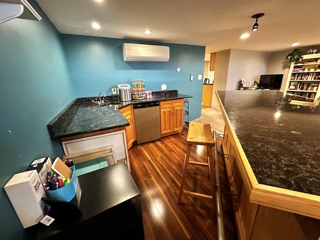 208 N Caribou Rd, Presque Isle, ME 04769 - kitchen featuring a sink, an AC wall unit, recessed lighting, dark wood-type flooring, and stainless steel dishwasher