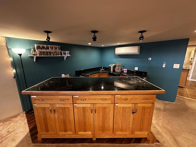208 N Caribou Rd, Presque Isle, ME 04769 - kitchen featuring dark countertops, a wall unit AC, and a center island