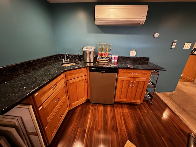 208 N Caribou Rd, Presque Isle, ME 04769 - kitchen featuring brown cabinetry, a wall mounted air conditioner, dark wood-style floors, a sink, and dishwasher