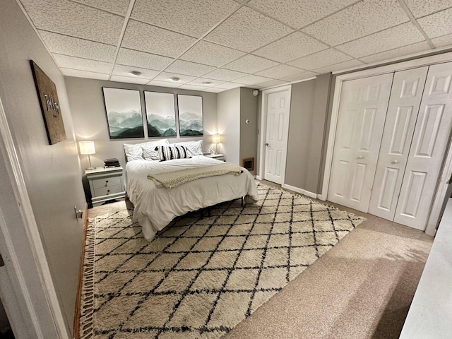 208 N Caribou Rd, Presque Isle, ME 04769 - bedroom with baseboards, carpet, a drop ceiling, and a closet