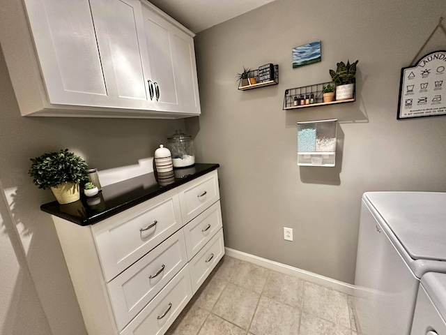 208 N Caribou Rd, Presque Isle, ME 04769 - laundry area with washing machine and clothes dryer, baseboards, light tile patterned floors, and cabinet space