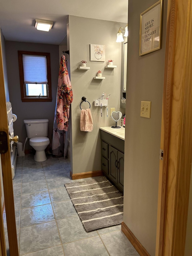 208 N Caribou Rd, Presque Isle, ME 04769 - bathroom featuring baseboards, tile patterned flooring, toilet, and vanity