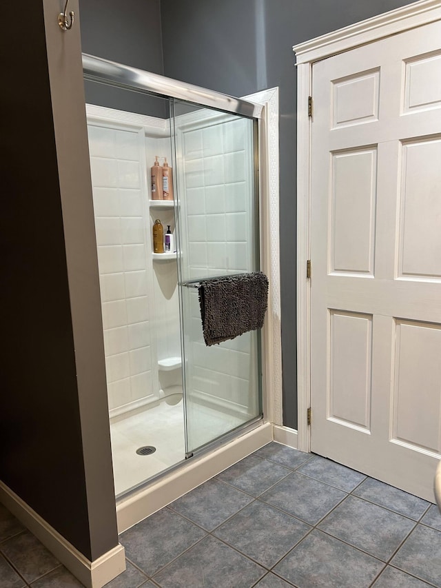 208 N Caribou Rd, Presque Isle, ME 04769 - bathroom featuring tile patterned floors, baseboards, and a stall shower