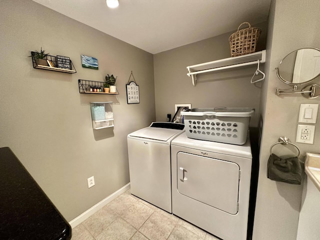 208 N Caribou Rd, Presque Isle, ME 04769 - washroom with baseboards, laundry area, independent washer and dryer, and light tile patterned floors