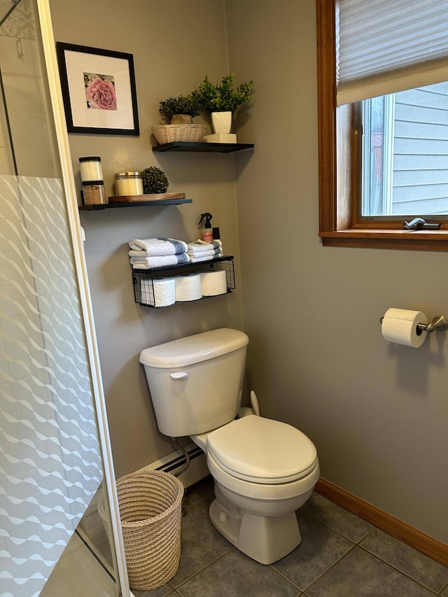 208 N Caribou Rd, Presque Isle, ME 04769 - bathroom featuring tile patterned floors, baseboards, toilet, and a shower with shower curtain