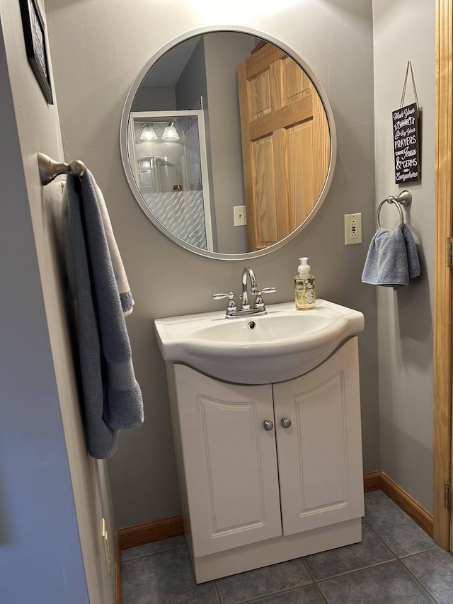 208 N Caribou Rd, Presque Isle, ME 04769 - bathroom featuring vanity, baseboards, and tile patterned floors