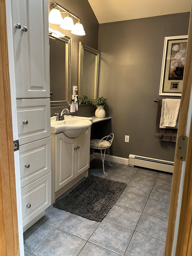 208 N Caribou Rd, Presque Isle, ME 04769 - bathroom featuring baseboards, tile patterned floors, baseboard heating, and vanity