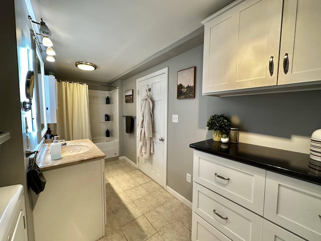208 N Caribou Rd, Presque Isle, ME 04769 - full bathroom with vanity, baseboards, shower / bath combo with shower curtain, and tile patterned floors