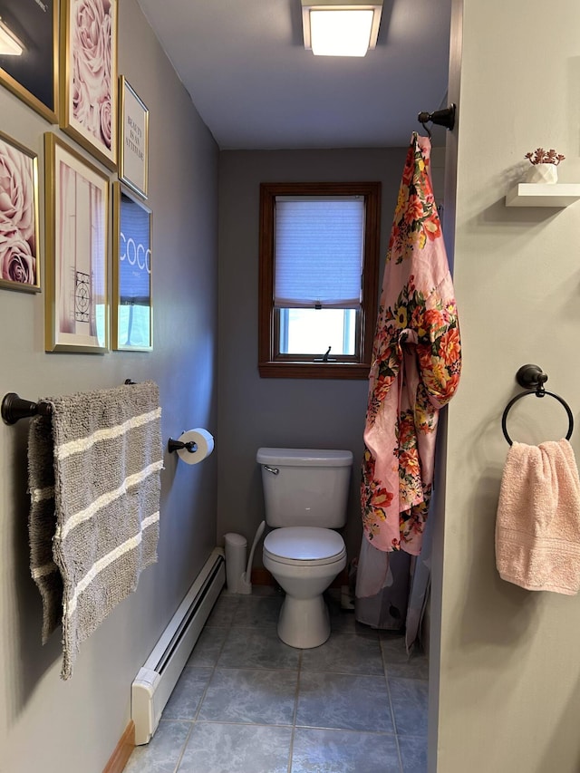 208 N Caribou Rd, Presque Isle, ME 04769 - bathroom featuring baseboards, tile patterned flooring, a baseboard heating unit, and toilet