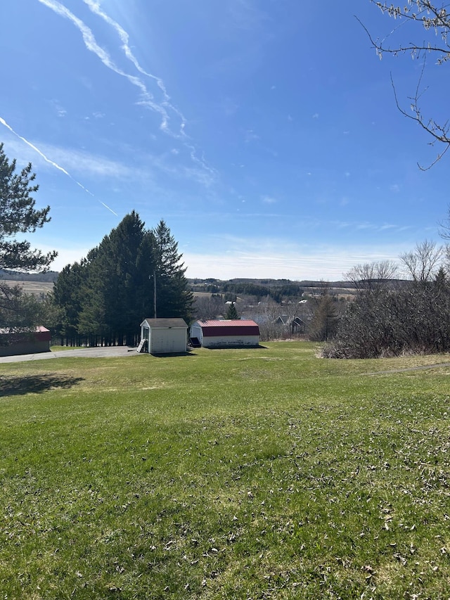 208 N Caribou Rd, Presque Isle, ME 04769 - view of yard featuring an outbuilding and a storage unit