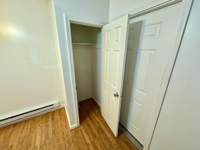 closet featuring a baseboard heating unit