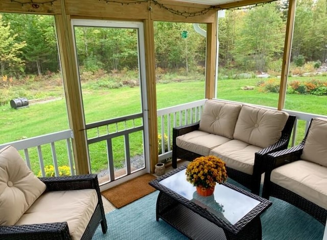 sunroom with plenty of natural light and an outdoor hangout area
