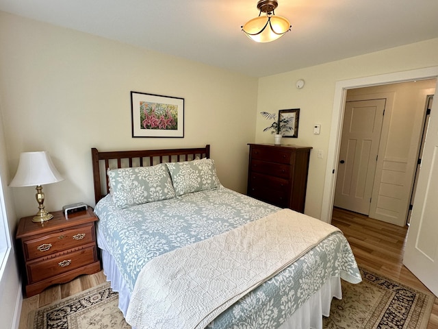 bedroom with wood finished floors