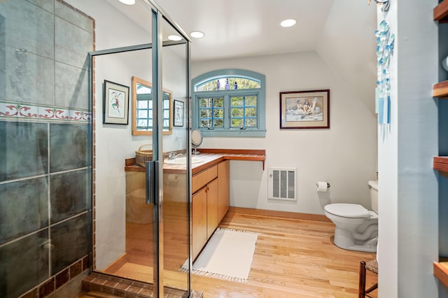 full bath with visible vents, wood finished floors, toilet, recessed lighting, and a shower stall