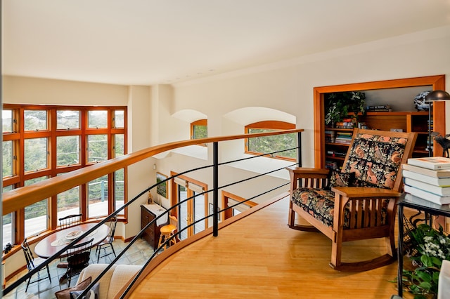 living area featuring an upstairs landing
