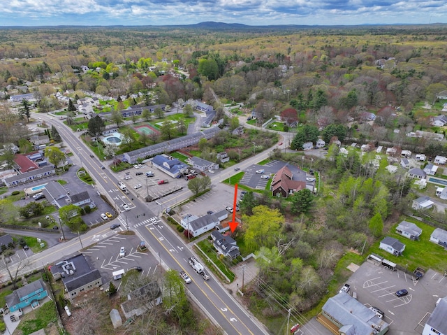 aerial view of property's location featuring a heavily wooded area