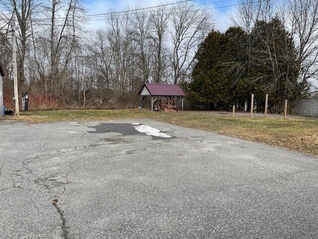 view of road featuring aphalt driveway