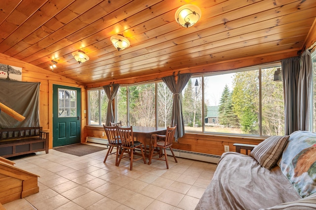 sunroom / solarium with tile patterned floors, a baseboard radiator, vaulted ceiling, and wood walls