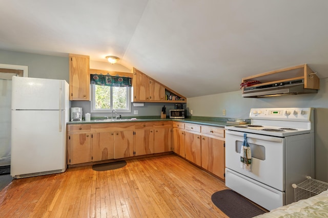 kitchen with a sink, white appliances, light wood-type flooring, under cabinet range hood, and vaulted ceiling